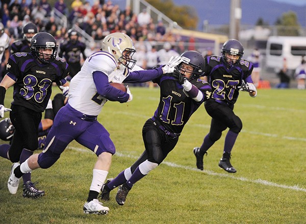 North Kitsap’s Sean Crowell gives Sequim defender Noah Christiansen a stiff arm in the first quarter of the Vikings' 27-10 win at Sequim on Sept. 25. North Mason comes to Poulsbo on Oct. 2 for the Vikings' homecoming game.