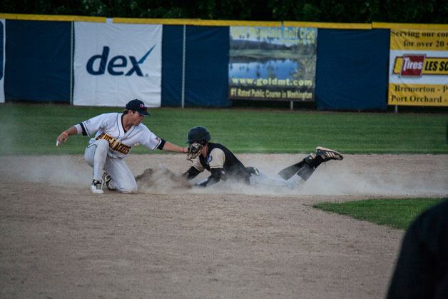 Kitsap BlueJackets’ second baseman tries to tag out the Bend baserunner stealing second. The runner was safe.