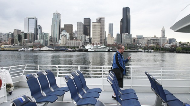 Commuter John Hines waits for the Spirit of Kingston to dock Tuesday at Pier 50 in Seattle.