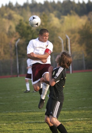 South Kitsap’s Justin Moore uses his head in the Wolves scoreless tie on Tuesday against Lincoln.