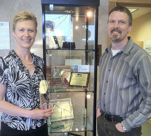 Nell Clausen and Rick Gross of Estes Builders. The firm has received a top rating from Avid Ratings