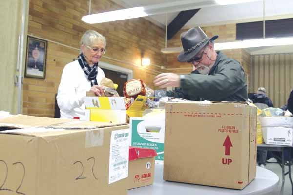 Carolyn and Gil Morales of Hansville contributed in November to the Thanksgiving dinner box program at St. Vincent de Paul in Poulsbo. Carolyn said contributing a box of food makes her realize how fortunate she is. “You want to do so much