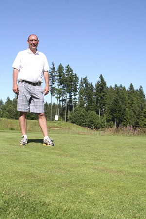 Scott Alexander pauses Tuesday on the Cascade Course at Gold Mountain Golf Club as the course prepares to host the 2011 Junior Amateur this month.