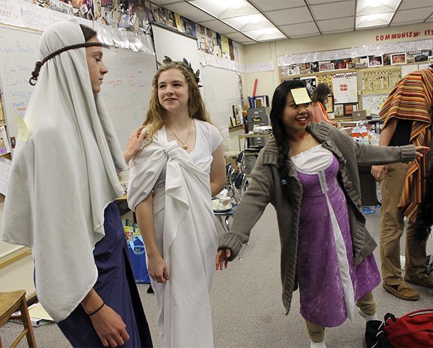 Central Kitsap High School AP World History students share a fun moment during a class project this week. The students were required to research a prominent historical figure
