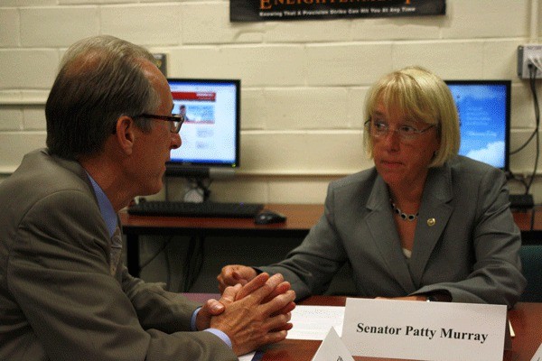 Senator Patty Murray and Richard Tift from the Puget Sound Naval Shipyard and Intermediate Maintenance Facility chat at Olympic College Wednesday morning.
