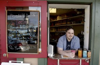 Higher Groundz owner Ben Rogers offers up a warm stop at his corner coffee shop at Jensen and Front Street.