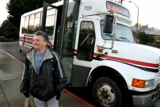 Kitsap Transit rider Helen Wilson disembarks the No. 32 shuttle Wednesday morning. She relies on the transit system for much of her county travel.