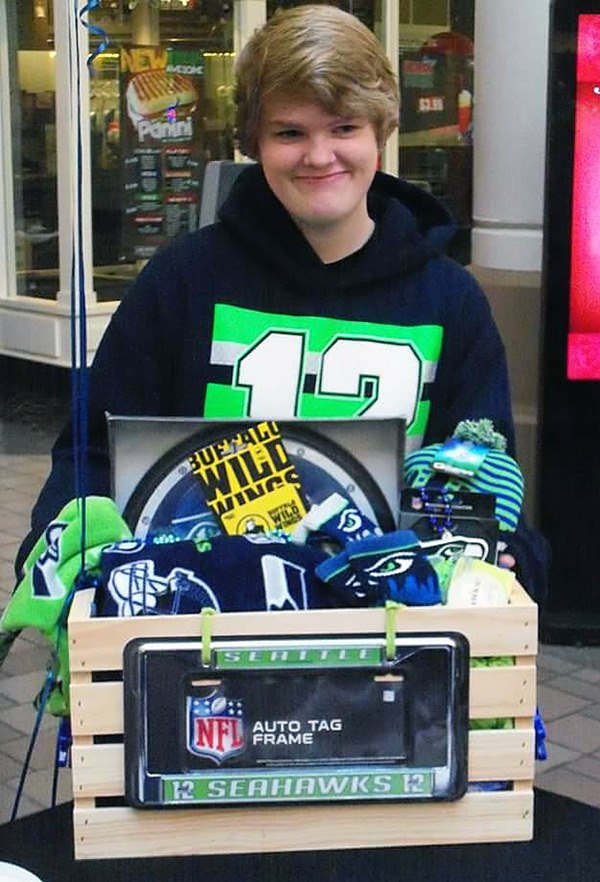 Heather Kettel won the Relay For Life NK “Kick Off “ give-away crate that was full of Seahawk merchandise and other items