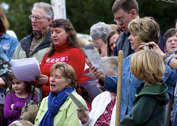 members of the Vinland Lutheran Church congregation sing at the groundbreaking ceremony for the new church building