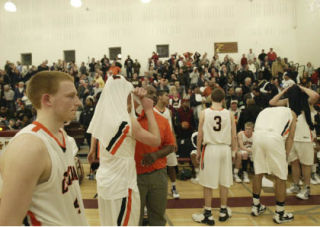Central Kitsap players react following Donald Gaddy’s 30-foot 3-pointer that beat the buzzer