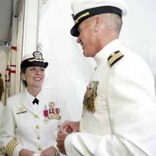 Capt. Catherine Wilson chats with Capt. Mark Brouker who relieved her Friday as commanding officer of Naval Hospital Bremerton.