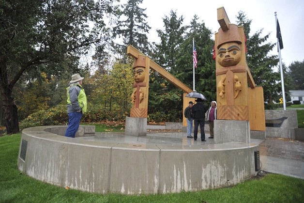 Suquamish Tribe Executive Director Wayne George surveys the newly finished Veterans Memorial Tuesday.