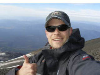 Chris Henrickson gives a thumbs up during his climb of Mount Adams Aug. 28 and 29 to benefit the Harrison Foundation. So far