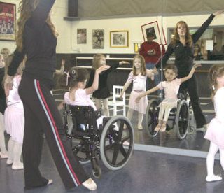 Just For Kicks owner Tanya Bleil-Geiselman leads Michaella Hargrove through a dance routine Wednesday as part of the 6-year-old’s ballerina dream-come-true courtesy of the Make-A-Wish foundation.