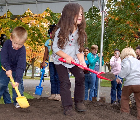 Some of the children currently in the daycare program at Olympic College help the administrators with the groundbreaking ceremony.