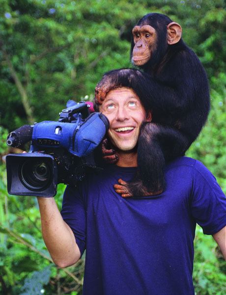 A chimp makes itself at home at Martin Kratt's head on one of the brothers' patented Creature Adventures.
