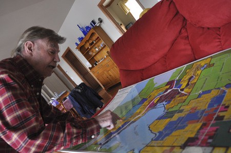 Hank Mann-Sykes looks at a map of Silverdale’s urban growth area. Mann-Sykes has been an advocate for incorporation