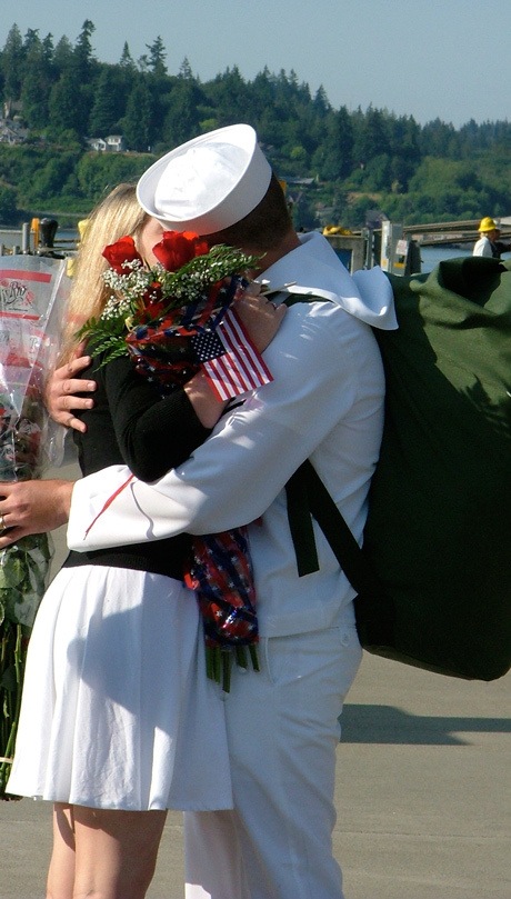 A sailor from the aircraft carrier USS John C. Stennis kisses his wife pierside after the ship arrived at Naval Base Kitsap-Bremerton Friday morning. Stennis has spent the last six months on deployment in the Western Pacific.