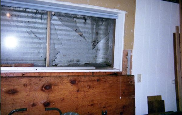 Wastewater built up behind this window to Phil Holt’s basement. The pressure blew the window out
