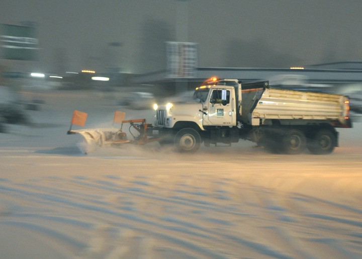 A Bremerton snow plow pushes snow in the early hours of the Jan. 18 snowstorm that so far has cost the city $25
