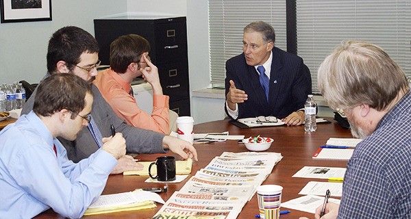 Gov. Jay Inslee outlines his budget funding strategy to members of the Reporter Newspapers staff. Reporter Newspapers is owned by Sound Publishing Co.