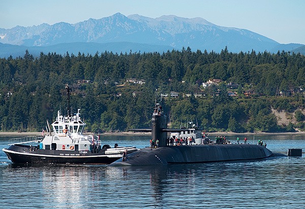 INDIAN ISLAND – Sailors assigned to the Ohio-class guided missile submarine USS Michigan (SSGN 727) Blue crew arrive at Naval Magazine Indian Island following a 20-month deployment. Michigan was forward deployed to Guam