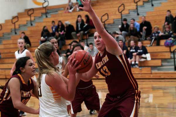 Spartans sophomore Katie Usellis finds it difficult to get around the defensive efforts of Kingston High's Anna Gaines during the Spartan's first home game of the season