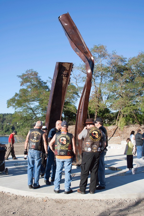 Members of the Combat Veterans Association stand at the Kitsap 9/11 Memorial in Evergreen Rotary Park prior to its formal dedication last week.