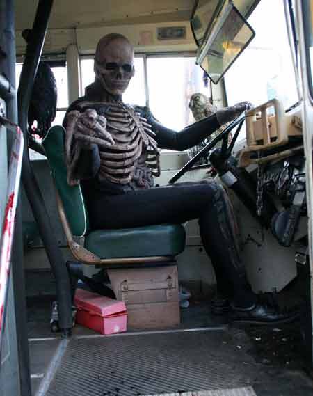 People must hop aboard a school bus before entering 'Horror High' at the Haunted Fairgrounds.