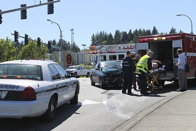 Central Kitsap Fire and Rescue loads an accident victim into an ambulance. The accident occurred at NW Randall Way and Kitsap Mall Boulevard this afternoon around 3 p.m.