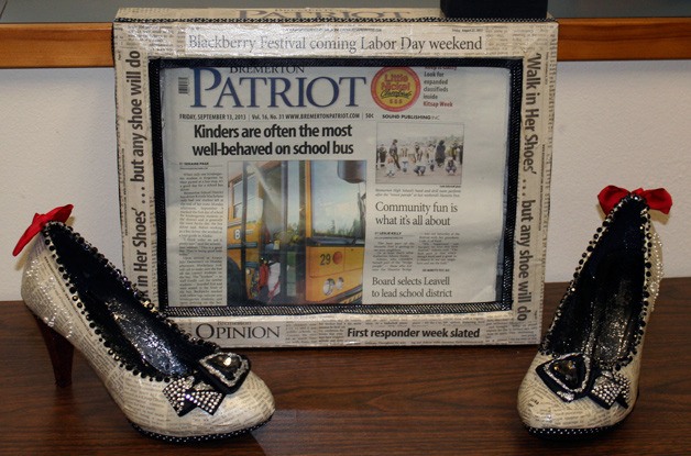 A pair of shoes auctioned at the In Her Shoes event incorporate the pages of the Bremerton Patriot.