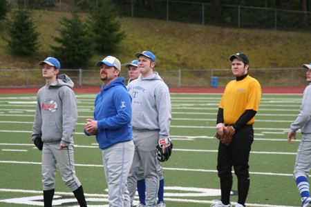Olympic High School Athletic Director and baseball head coach Nate Andrews leads the team’s first tryout Monday at Silverdale Stadium. Andrews believes having a coach who works in the same building is crucial for keeping in touch with athletes.