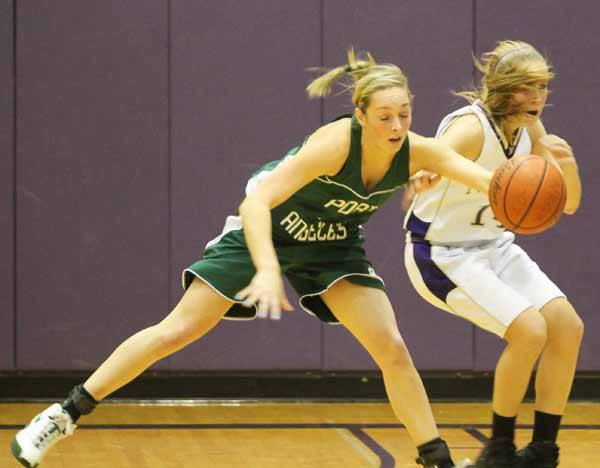 Port Angeles' Kiah Jones steals the basketball from North Kitsap's Rebekah Baugh Tuesday night during the League game in the North Kitsap High School Gymnasium. Jones had 23 points at the end of the game.