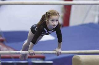 Kingston's Sam Thompson is a level 5 gymnast at age seven and probably the youngest competitor to qualify for a state berth in the USAG trials.