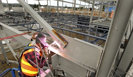 Welder Justin Bonifield with Olympia-based AK Steel works on a bead at the new city hall building in downtown Poulsbo.