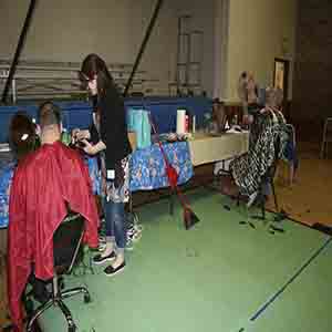 Hairdressers Diana Webber and Kim Aiello volunteered their time for the Stand Down for Vets on Saturday.