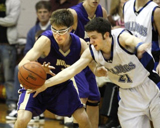 North Kitsap guard Brandon Huggins reaches for the ball during action against the North Mason Bulldogs Tuesday.