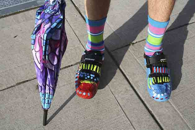 Ralph Marshall dressed himself in brightly colored shoes and clothing for the YWCA’s “Take a Walk in Her Shoes” event.