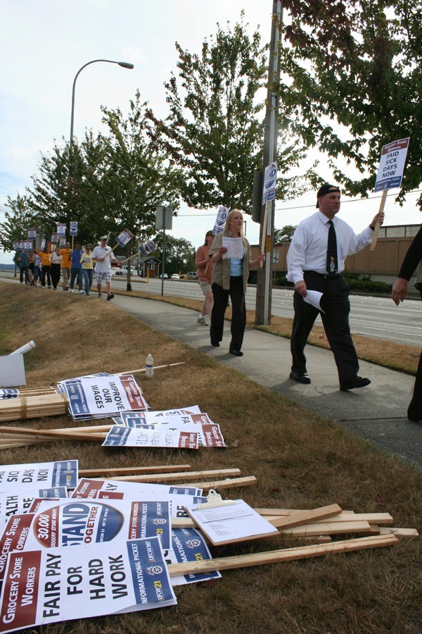 Grocery workers picket last week in front of Albertsons on Wheaton Way.