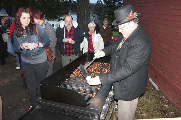 Chuck Kraining roasts chestnuts at the Mill Town Christmas.