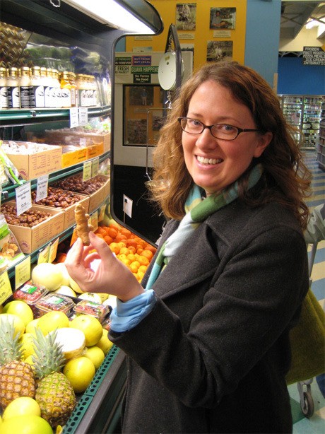 Laura Moyhihan peruses the goods at a local farmers market.