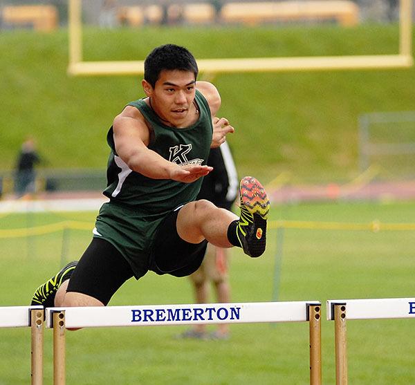 Klahowya’s Alex Gomez bounds in the air during the 100 meter hurdles in Bremerton on May 14.