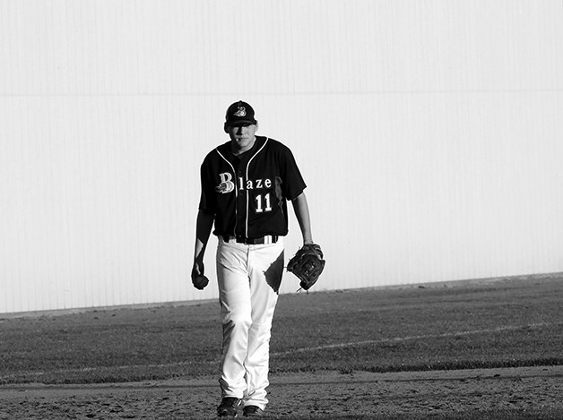 Ben Merrill walks the field during a Northwest Blaze ball game. Merrill has stayed active since graduating from BHS.