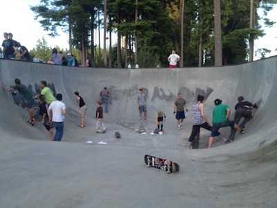 SKSPA members and local teens help clean up graffiti on Tuesday evening at the South Kitsap Stake Park.