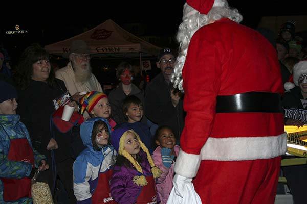 Santa delights a group of children who came out for the annual tree lighting in Old Town Silverdale last Saturday. The  event is the traditional kick-off of the season in Central Kitsap County.