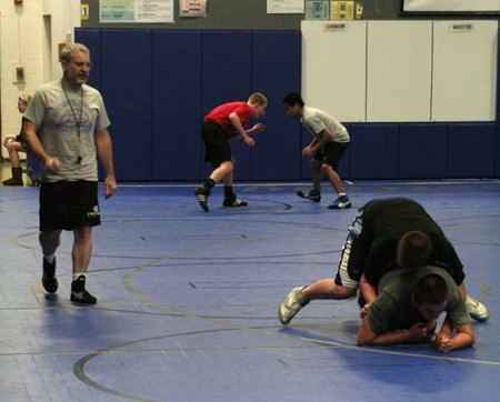 Trojans wrestling coach Steve Polillo leads one of his last practices before resigning Feb. 24.
