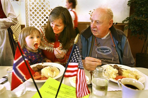 A youngster gets a taste of lutefisk in this file photo of the 2006 Sons of Norway lutefisk dinner. This year's event will be held from noon to 5 p.m. Saturday
