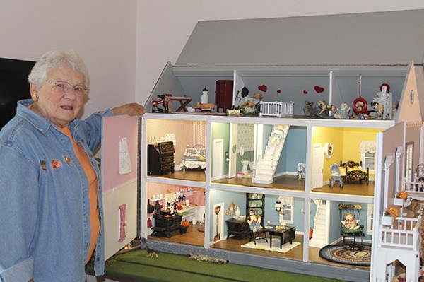Naomi Knudson loves to share her dollhouse with others. She built it years ago and has continued to furnish it with all the necessities. Her family has helped her.