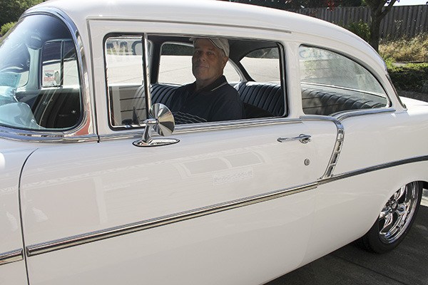 Ken Niemann of Ken’s Northwest Automotive behind the wheel of his 1956 Chevy two-door post