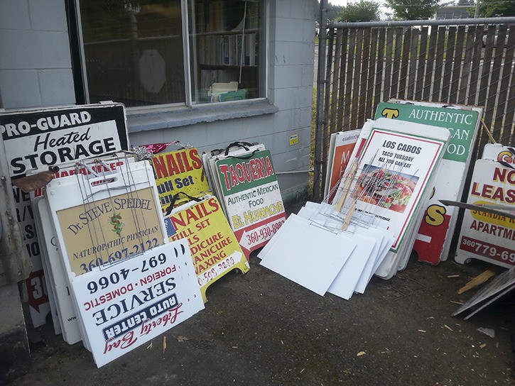 Impounded sandwich boards await their owners at the Poulsbo Public Works center on Iverson.